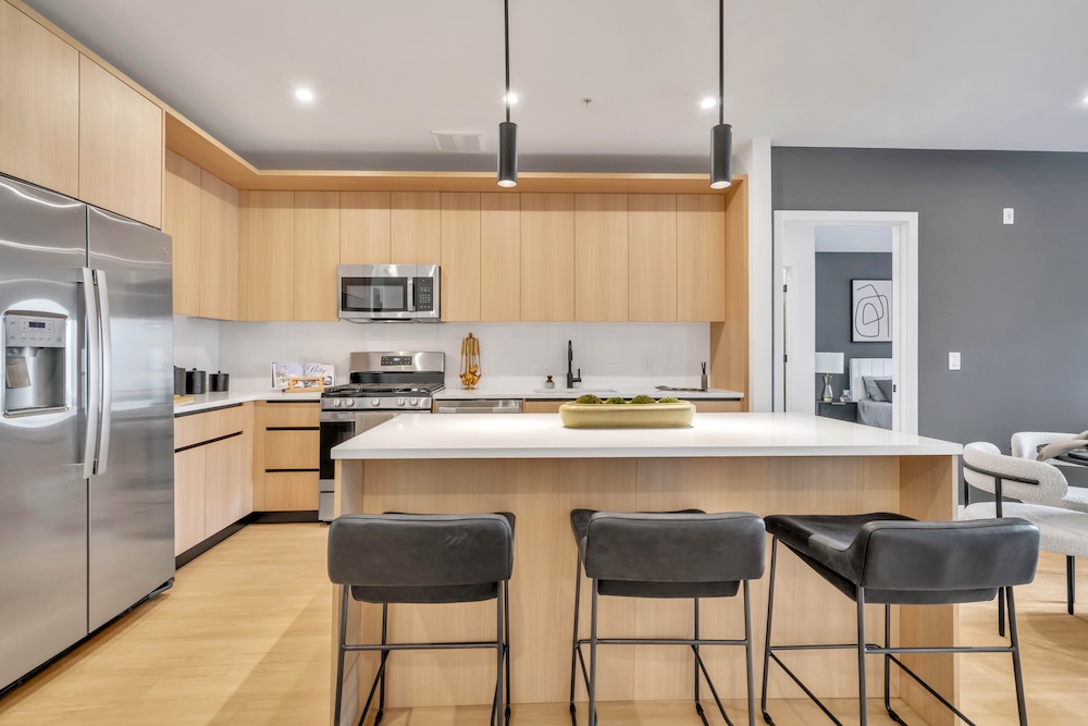 The essence of exceptional living Well-lit kitchen with ample counter space