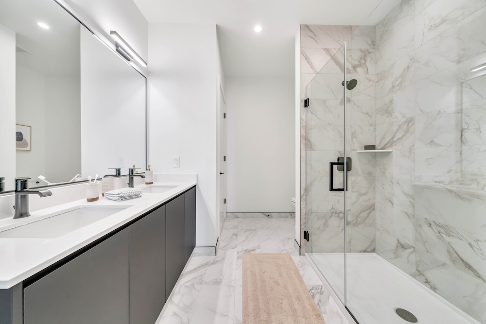 The essence of exceptional living Spacious bathrooms with glass shower
