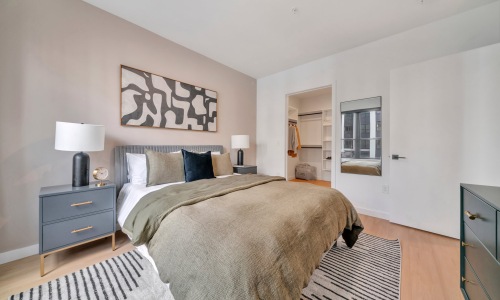 Sleep in style Bedroom with natural lighting and high ceilings