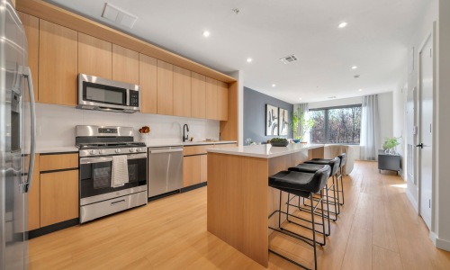 The essence of exceptional living Well-lit kitchen with ample counter space