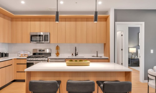 The essence of exceptional living Well-lit kitchen with ample counter space